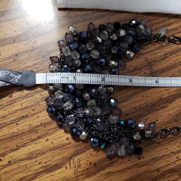 Vintage black necklace with a bib of iridescent beads - Picture 5 of 8